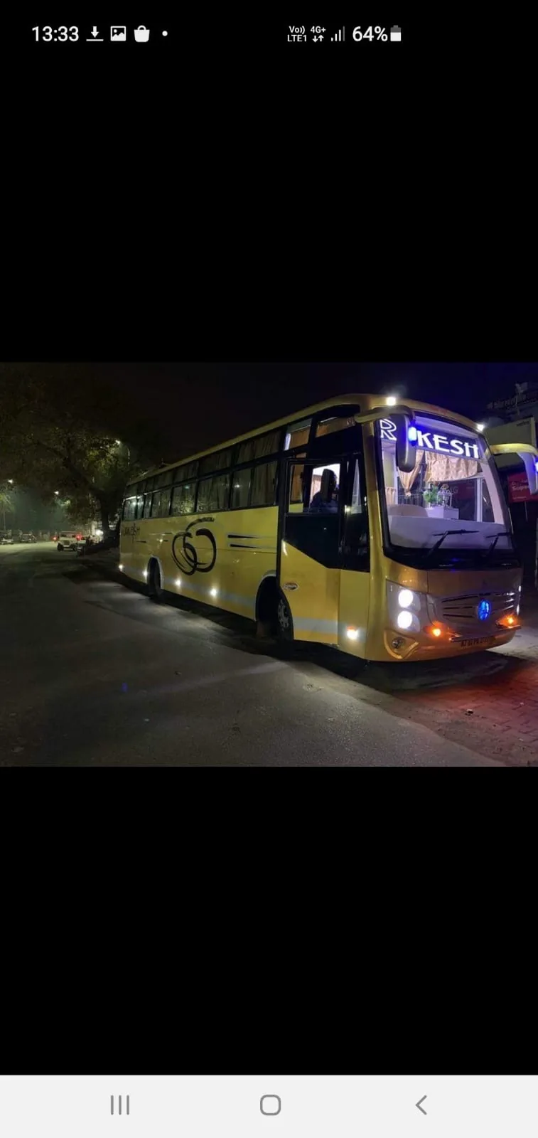 Rakesh Travels yellow tourist bus