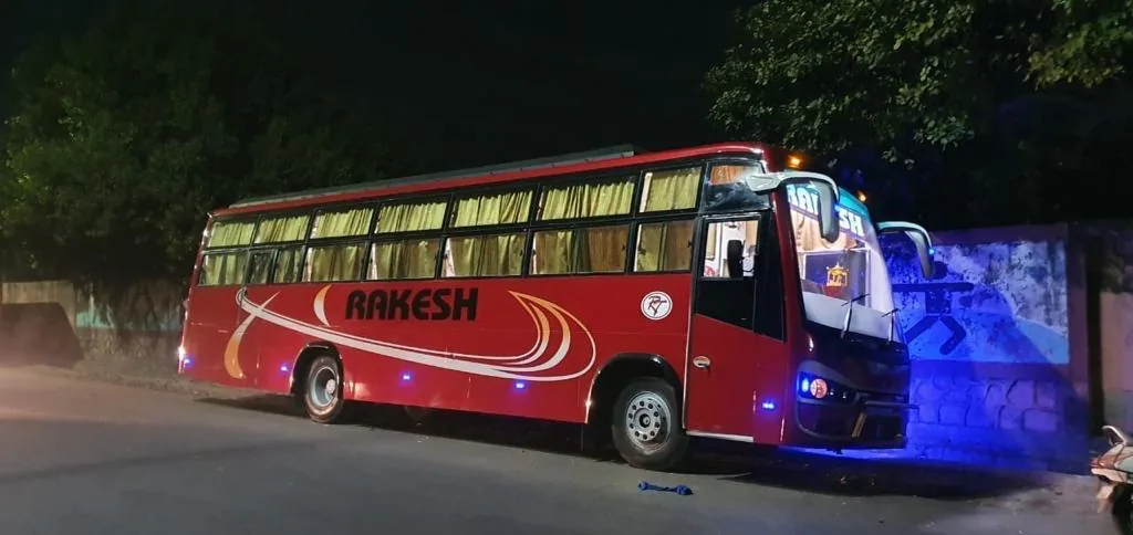 Rakesh Travels red bus at night