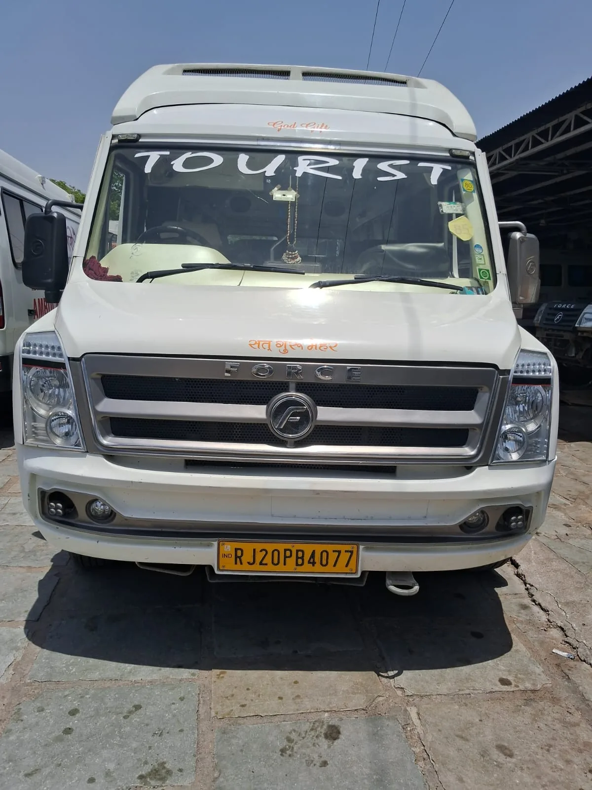 Rakesh Travels white tourist bus